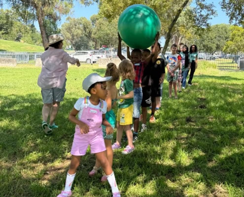 Ready to start with a ball play activity during the online school meet and greet in the park.