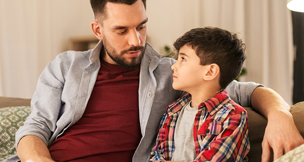 Father talking to his son about a very important matter.