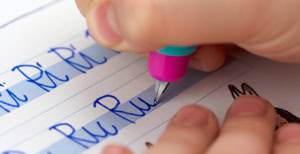 Child writing in cursive.