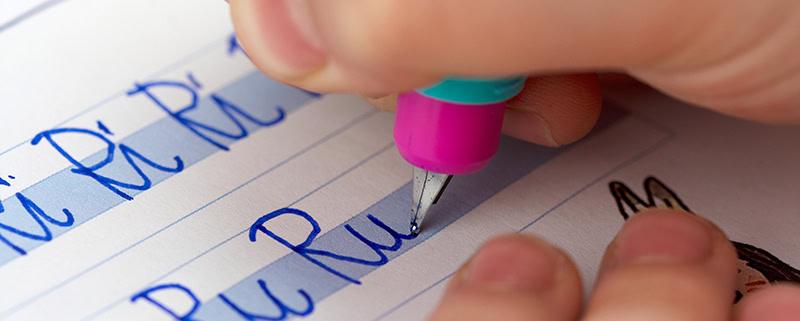 Child writing in cursive.